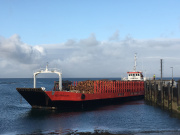 Timber ready to be 'eiggxported' from the Isle of Eigg by ship.