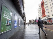 Passer-by with MyLand poster